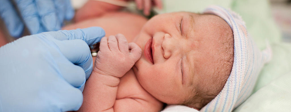New born examination by doctor